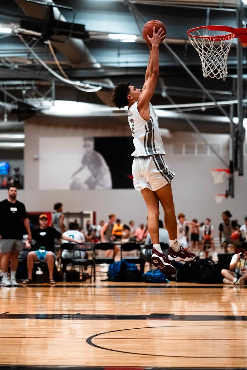 An AUSA Hoops player rising to finish at the rim