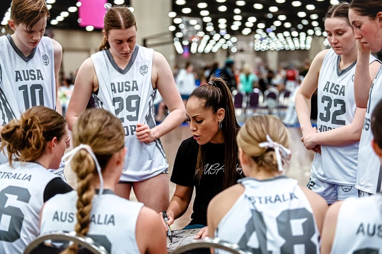 An AUSA Hoops coach drawing up a play with the girls team mid-tournament