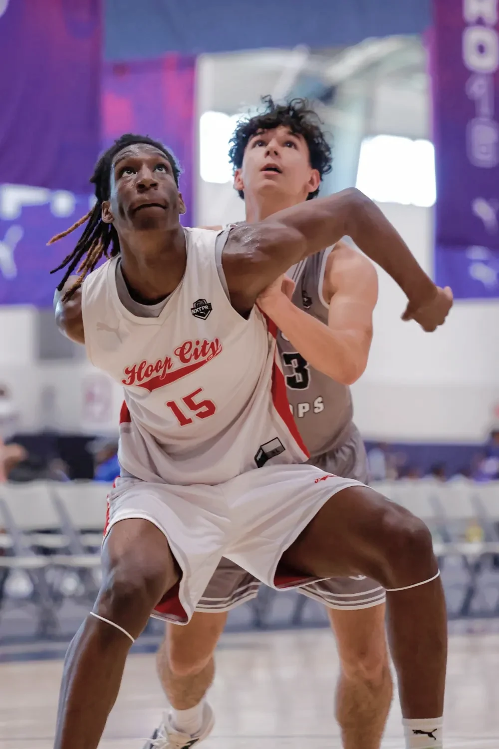 AUSA Hoops player boxing out a US opponent under the basket